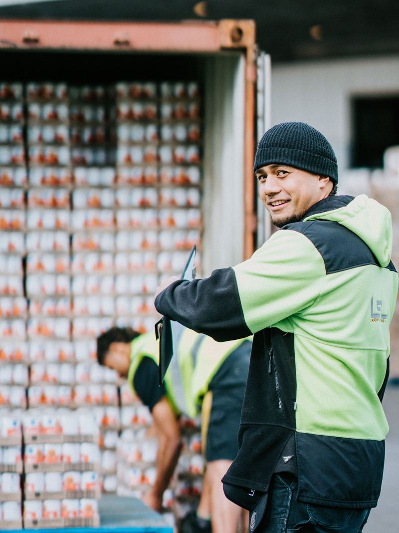 An LSL crew member inside a container mid unload